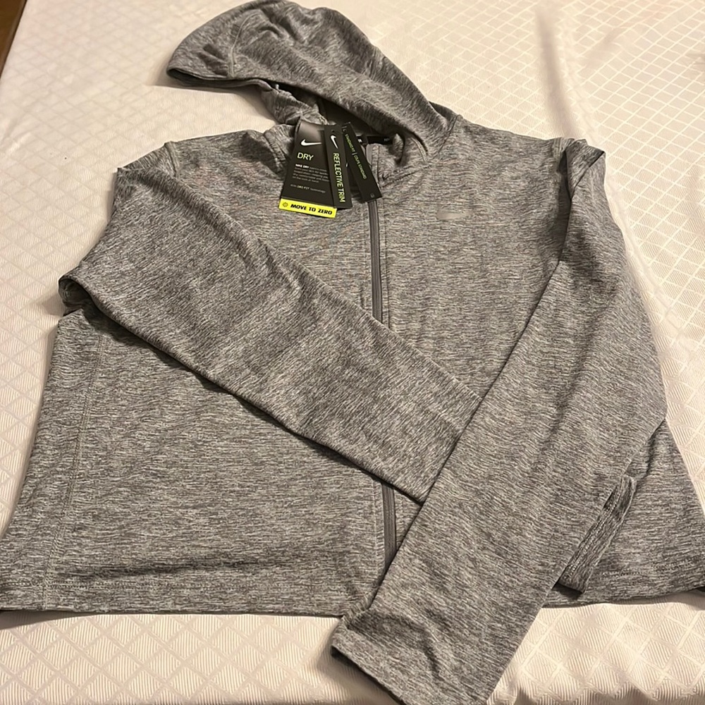 NWT Nike Dri-Fit cropped running jacket.   Standard Fit Reflective Trim